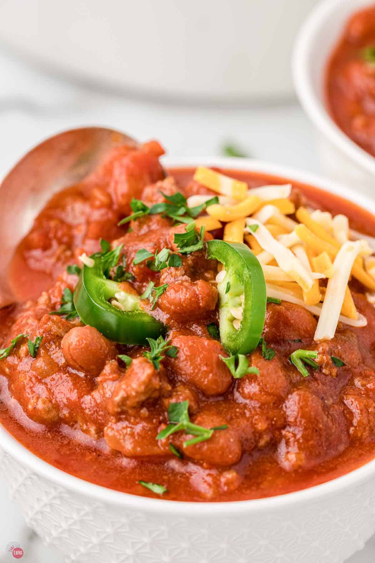 close up of side view of bowl of chili
