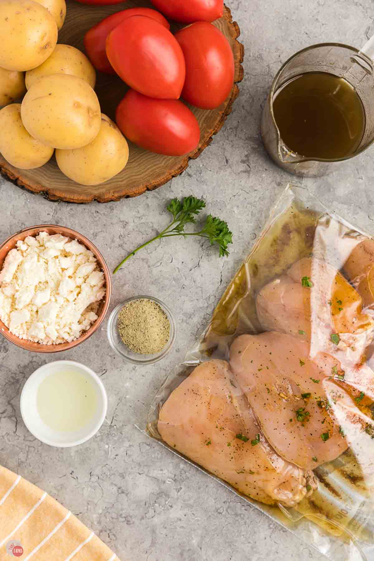 chicken breasts marinating in a plastic bag
