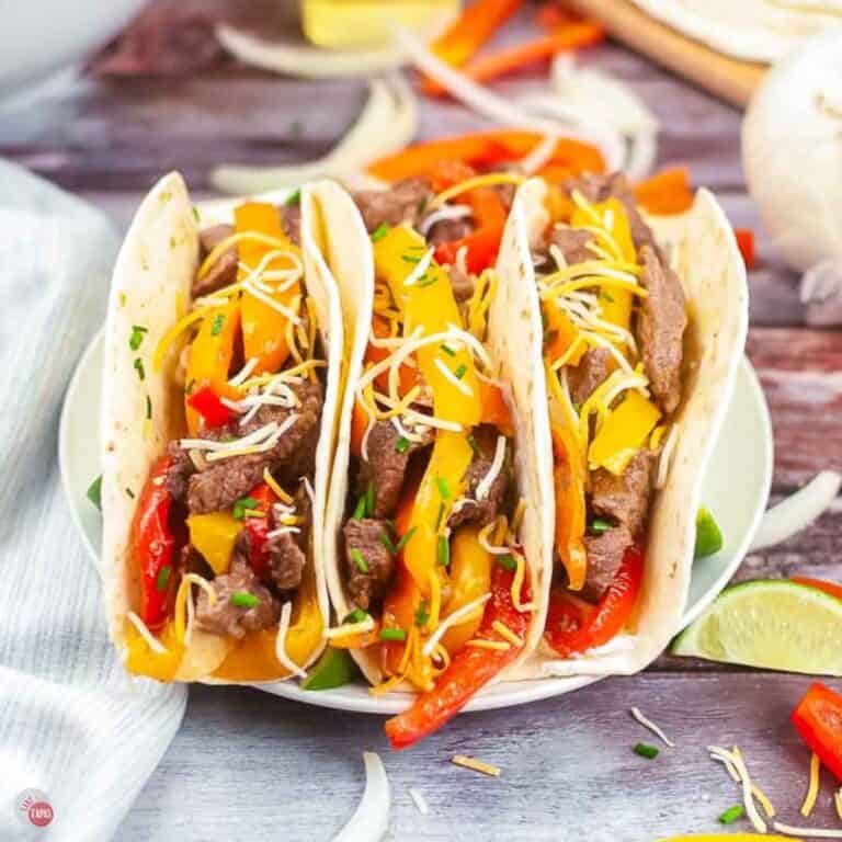 plate of three steak fajitas with cheese