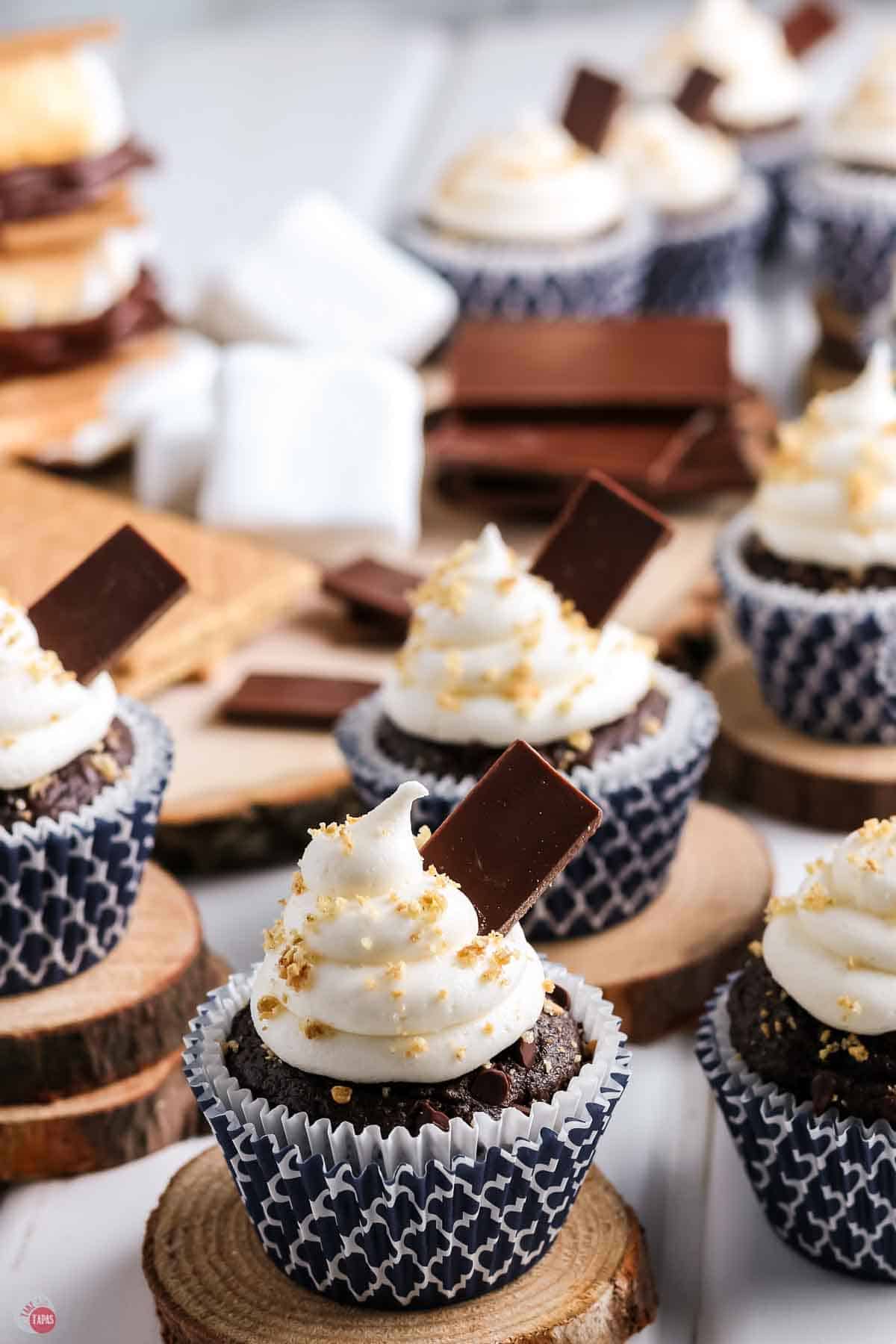 side view of cupcakes topped with pieces of chocolate