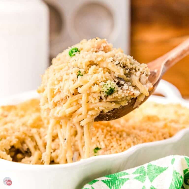 wood spoon scooping tuna tetrazzini out of a dish