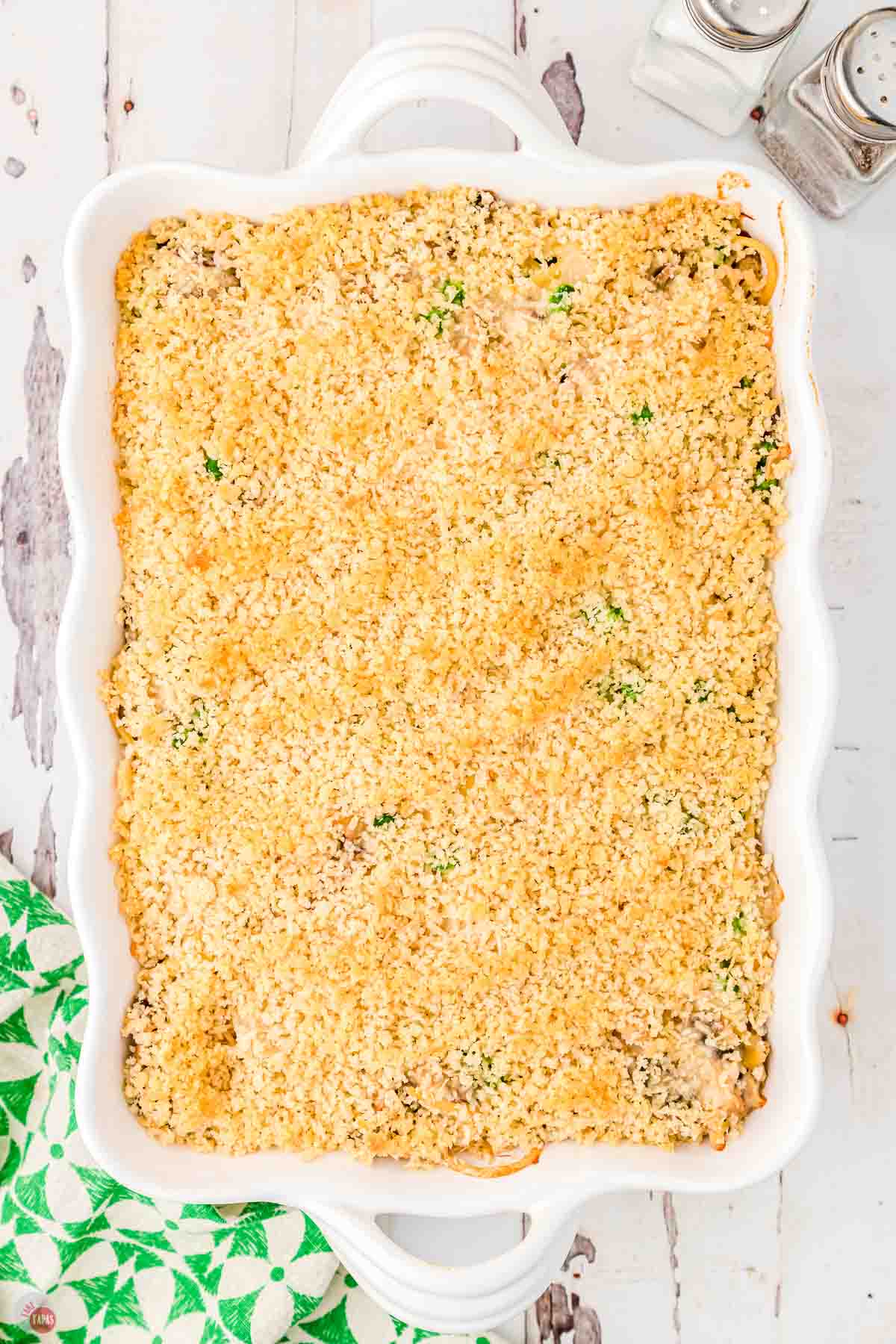 baked tuna tetrazzini casserole in a white baking dish