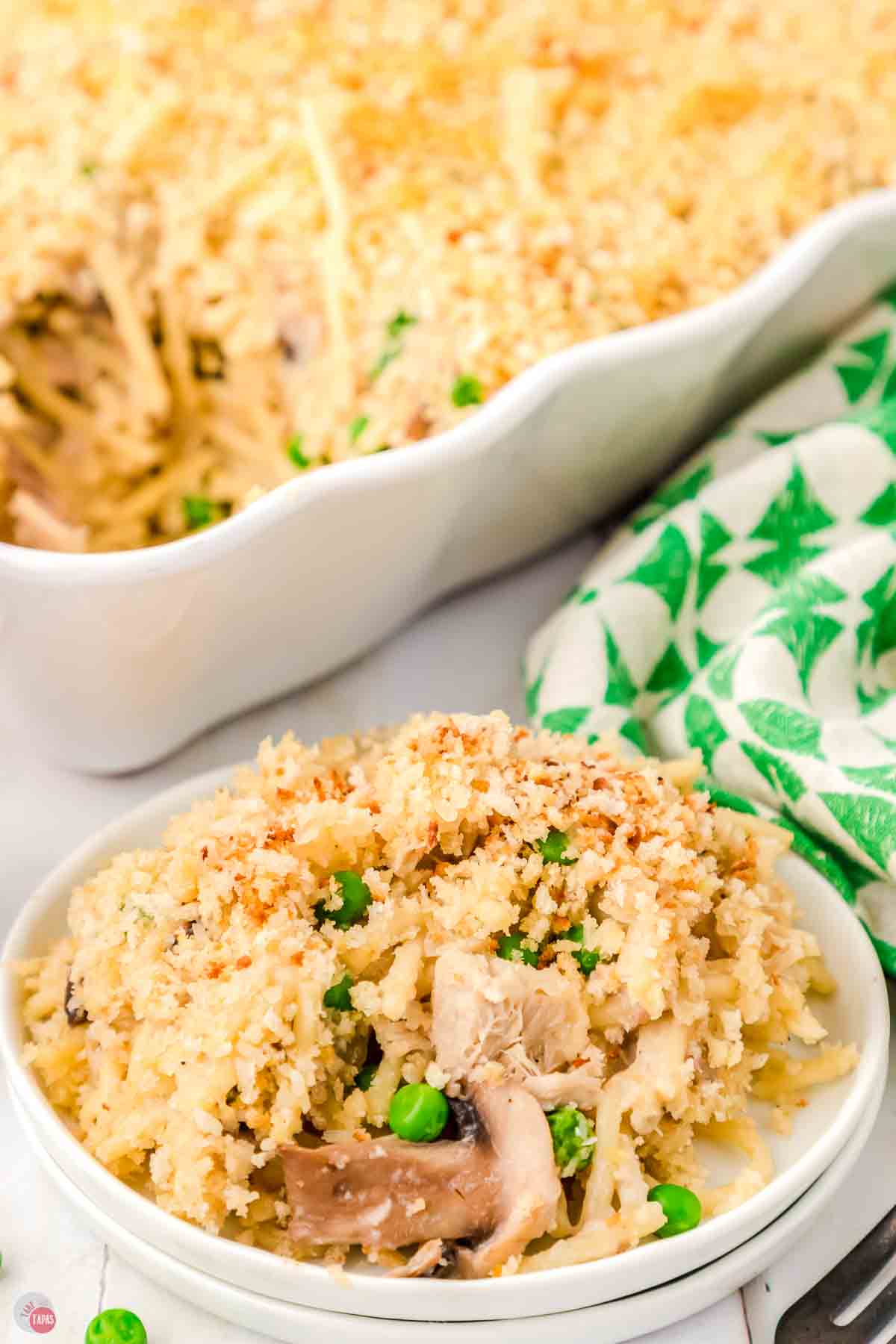 tuna tetrazzini in a white bowl next to a casserole dish