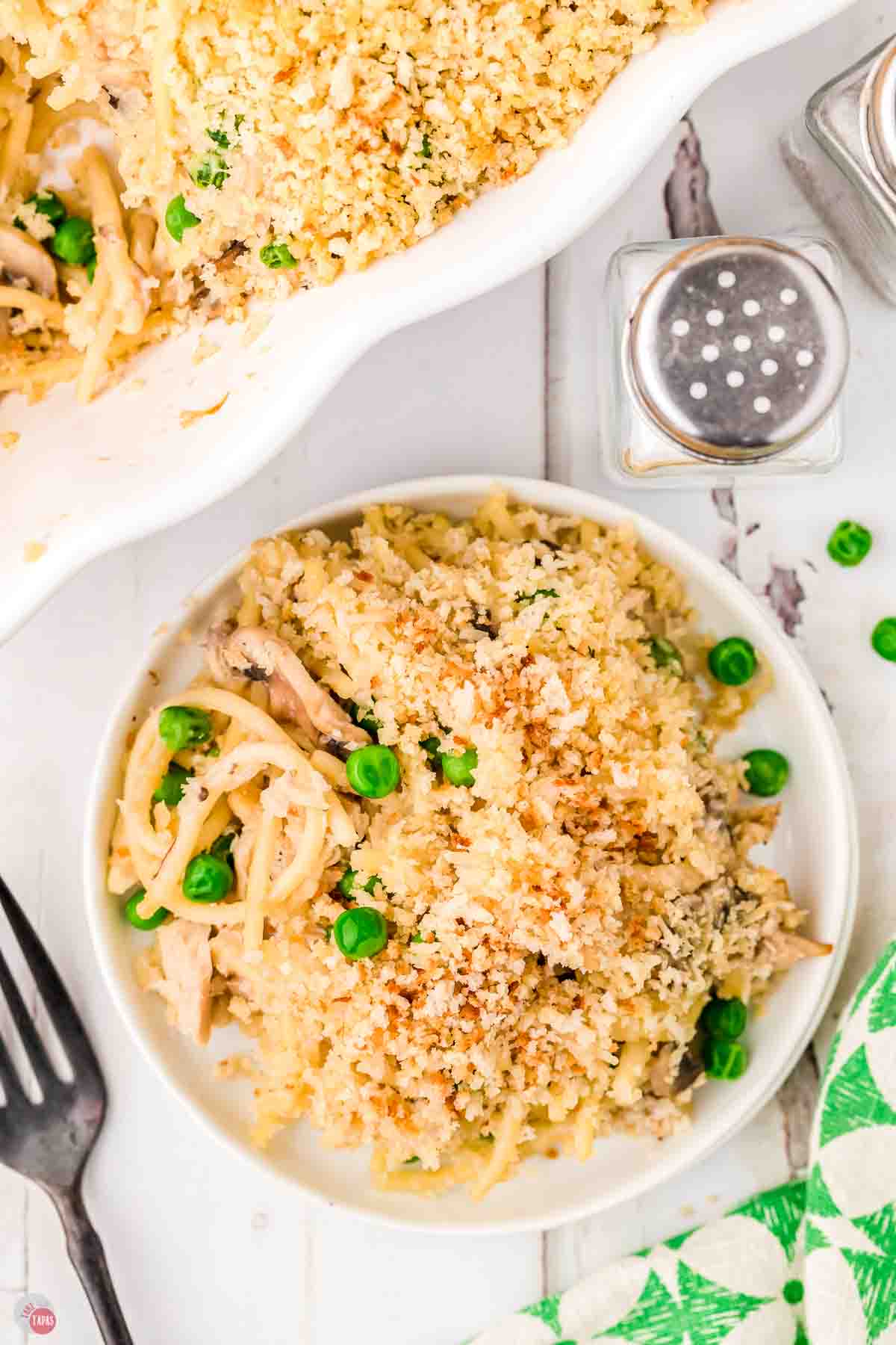 plate of tuna tetrazzini on a white wood board