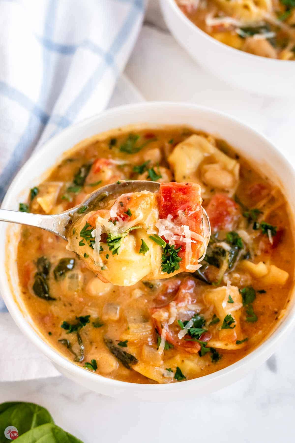 small bowl of soup with a spoon scooping some out