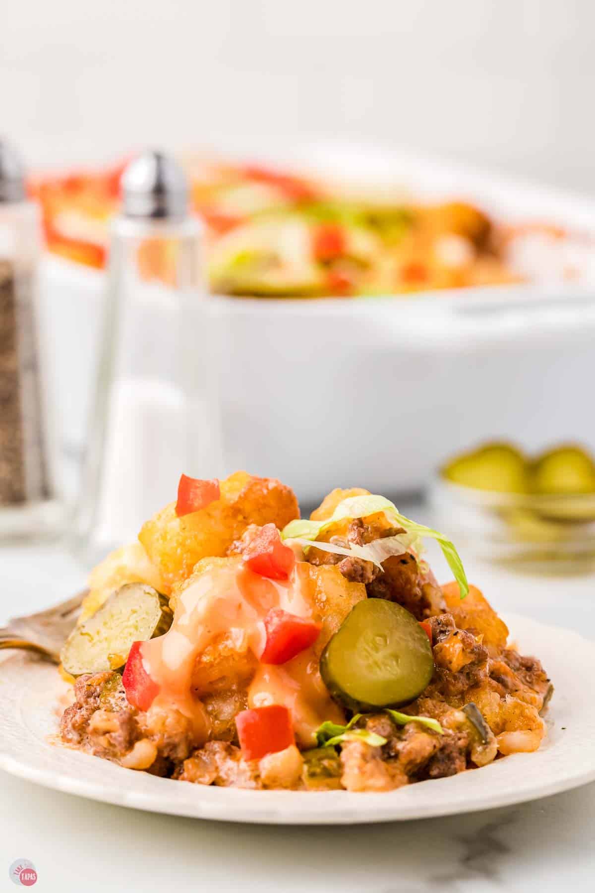 plate with scoop of casserole on it and salt and pepper shakers behind it