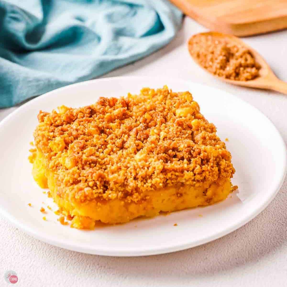 sweet potato casserole with cereal topping on a white plate