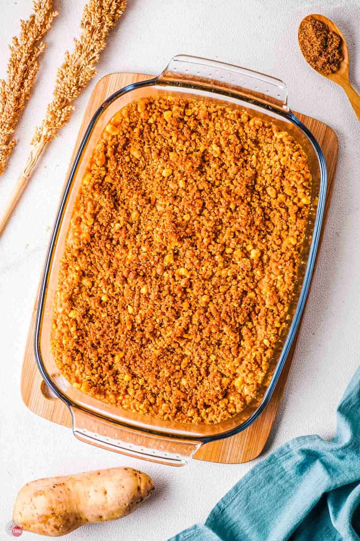 baked Captain Crunch casserole in a clear dish on a wood board