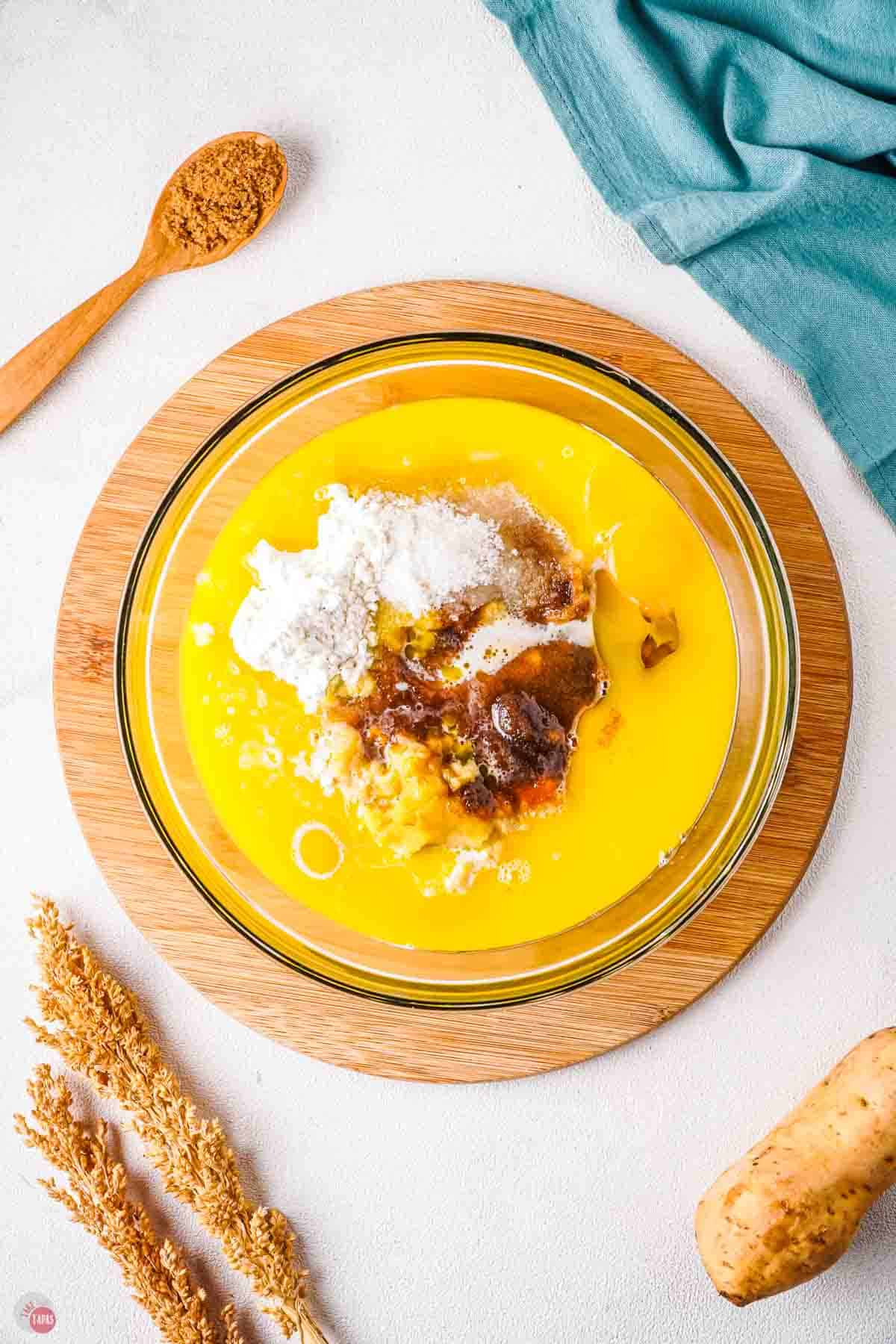 bowl of melted butter, sugars, and eggs