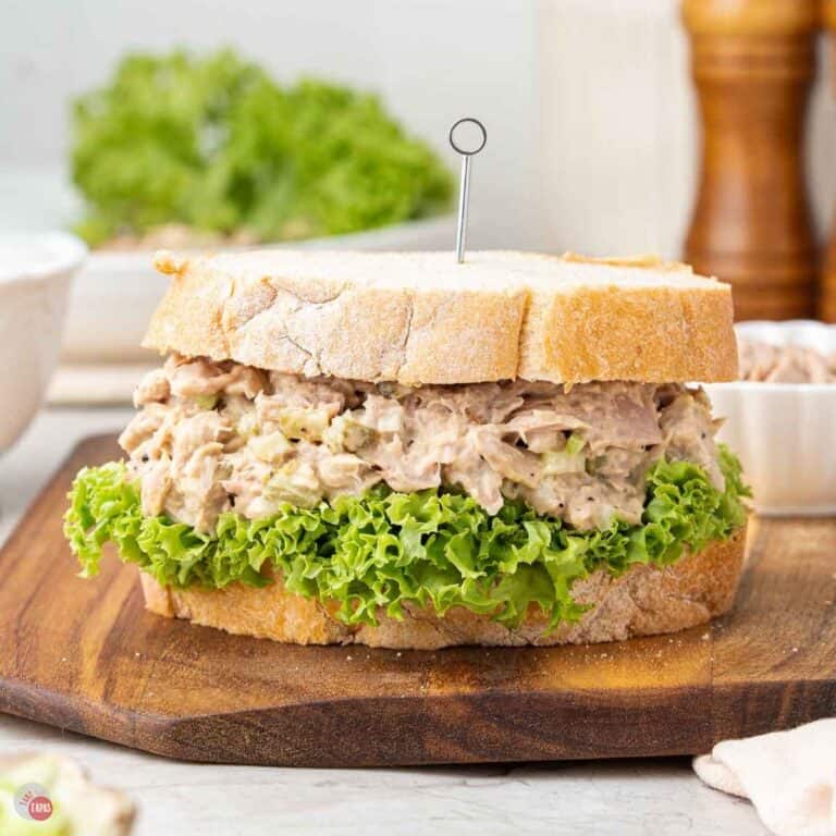 tuna salad sandwich on wood board