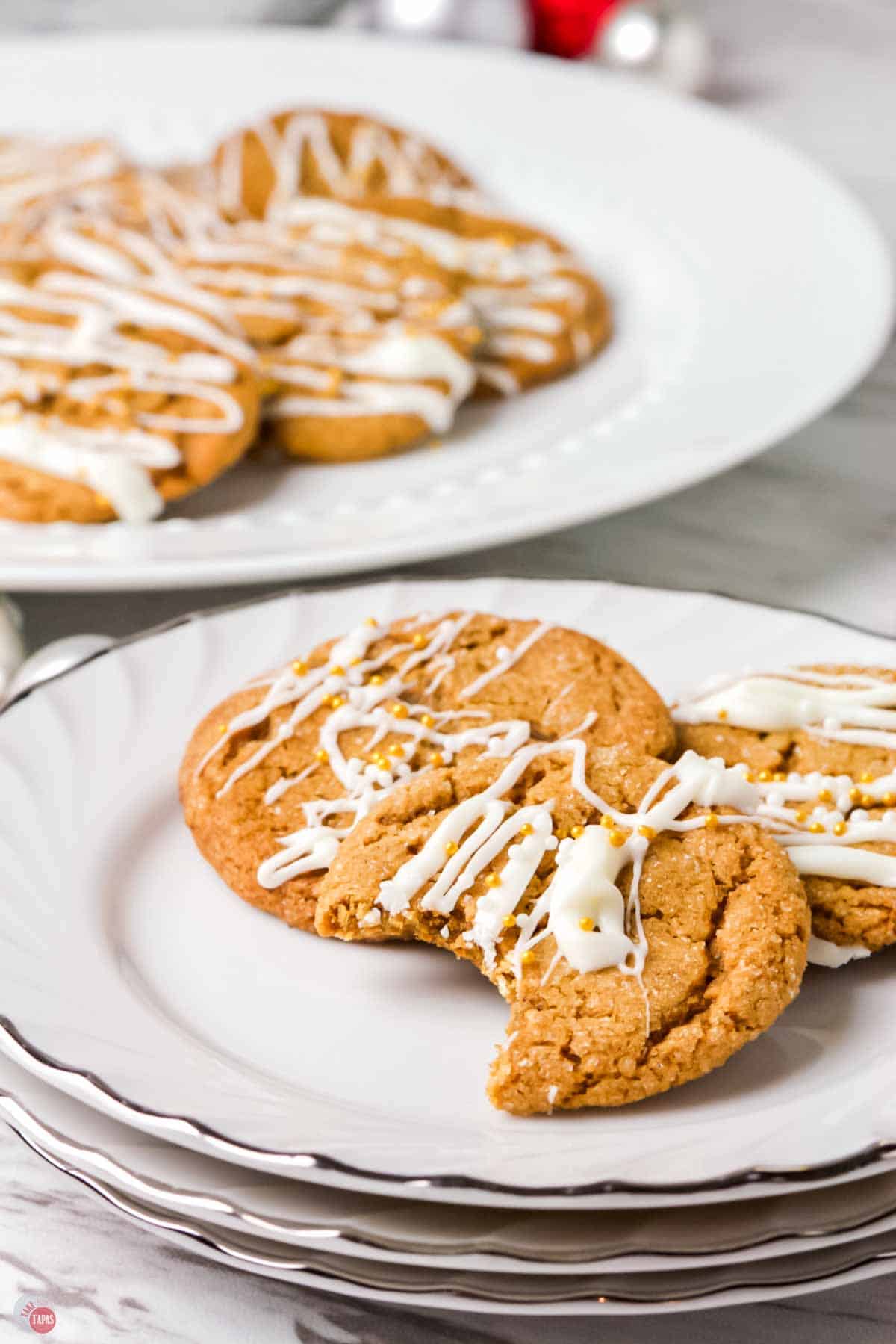 plate of molasses cookies drizzled with white chocolate