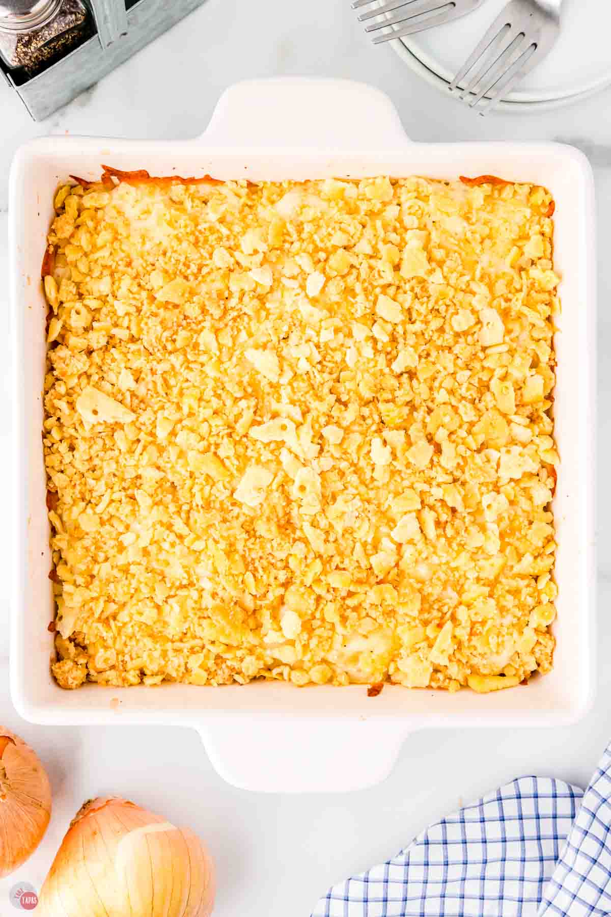 baked onion casserole in a square white baking dish