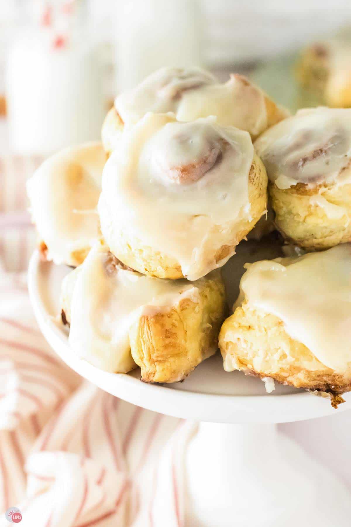 plate of cinnamon rolls with a glaze on top