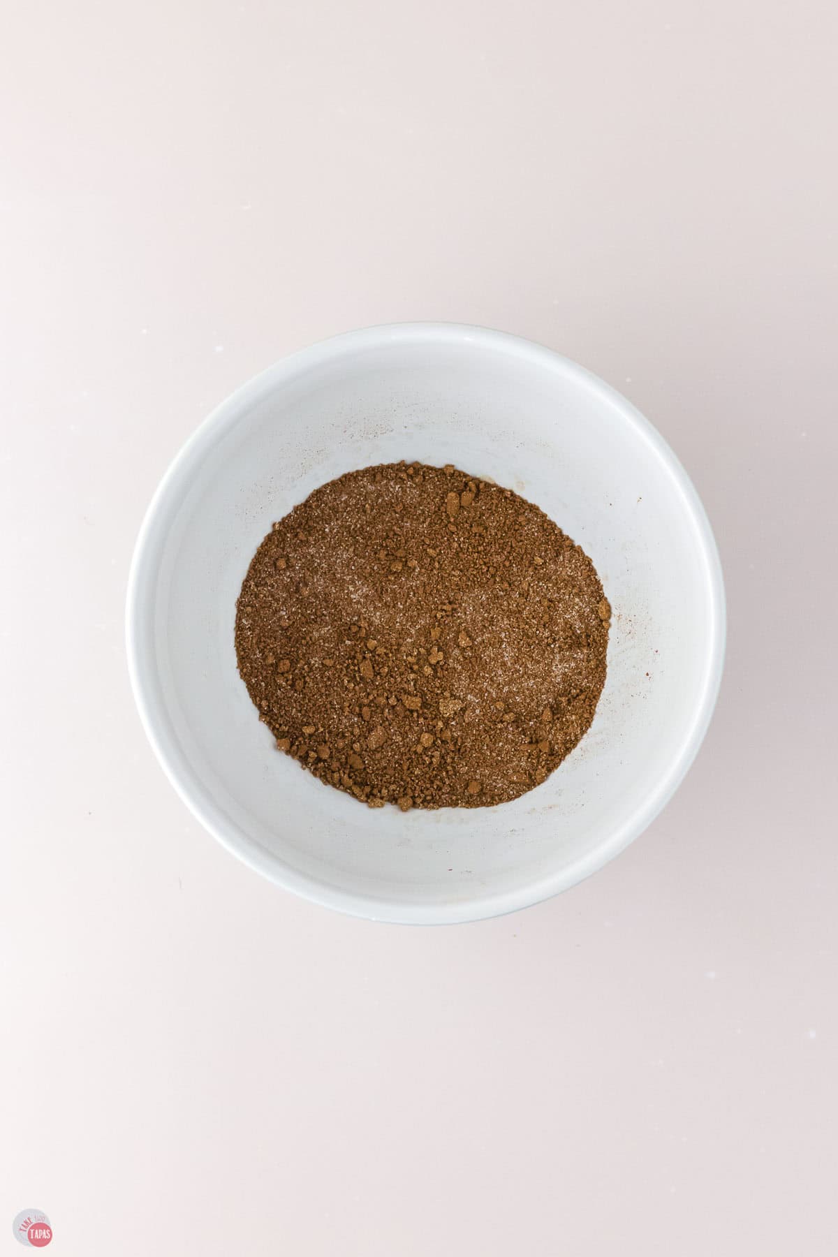 cinnamon and sugar mixture in a small white bowl