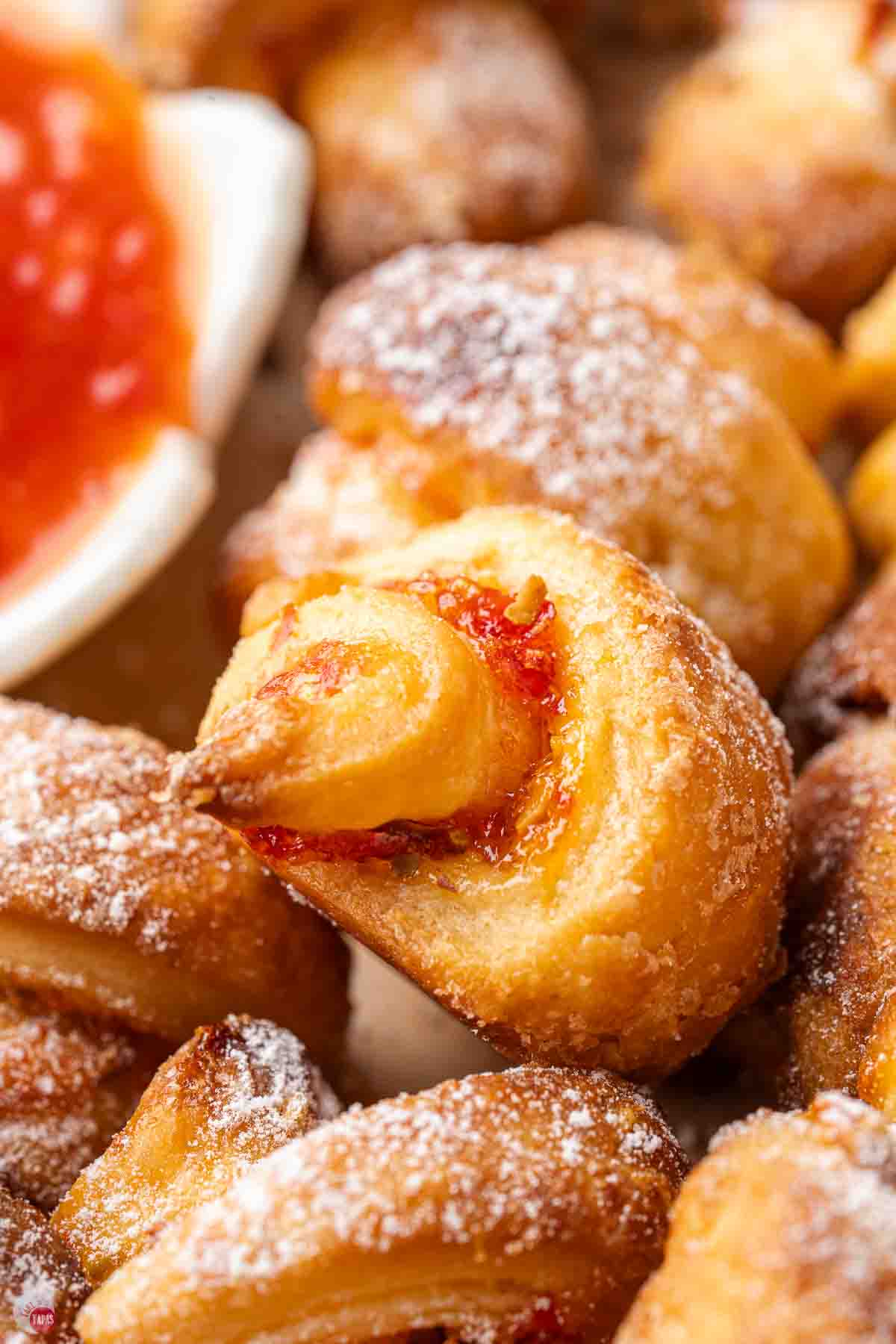 close up of rugelach cookie on top of a full stack of them