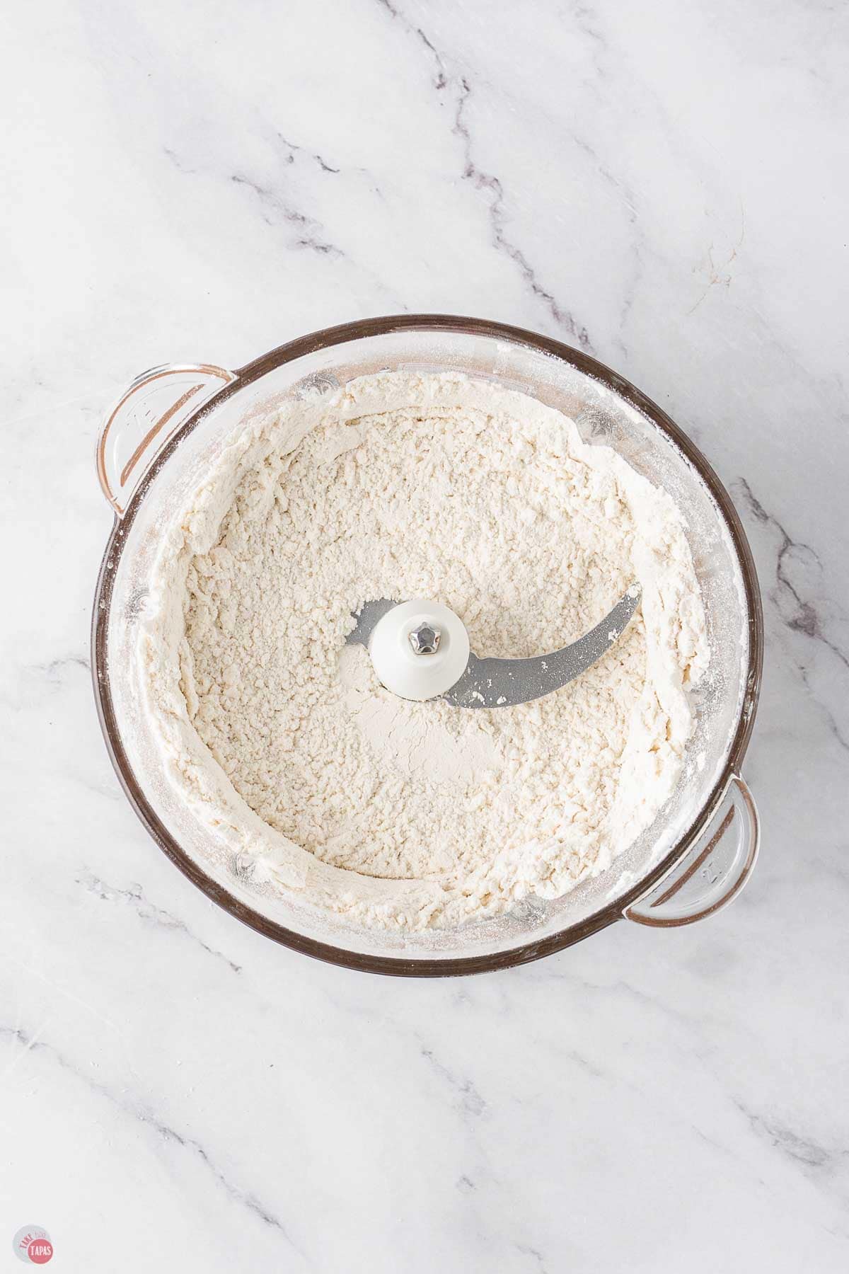 flour pulsing in a food processor