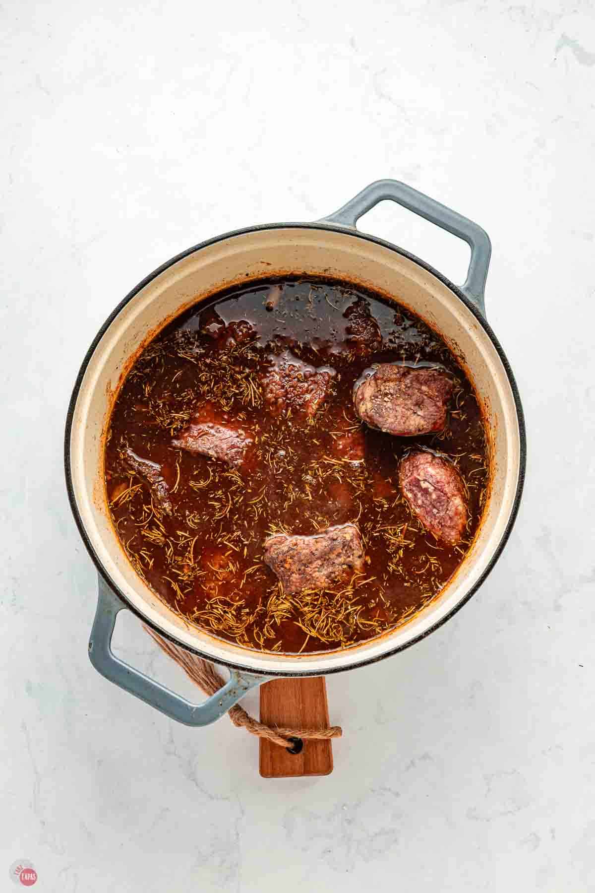 beef chunks simmering in a pot