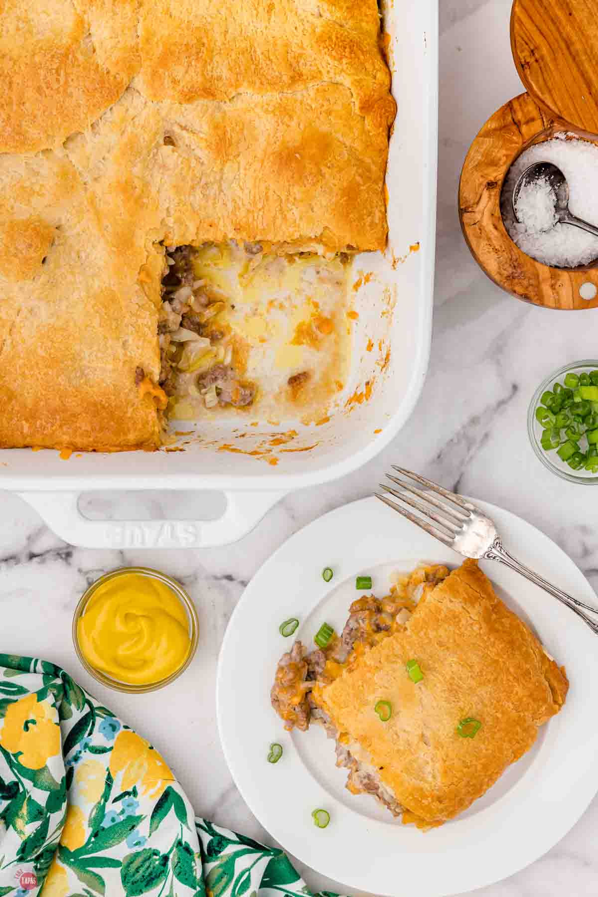 slice of runza casserole on a plate next to a baking dish