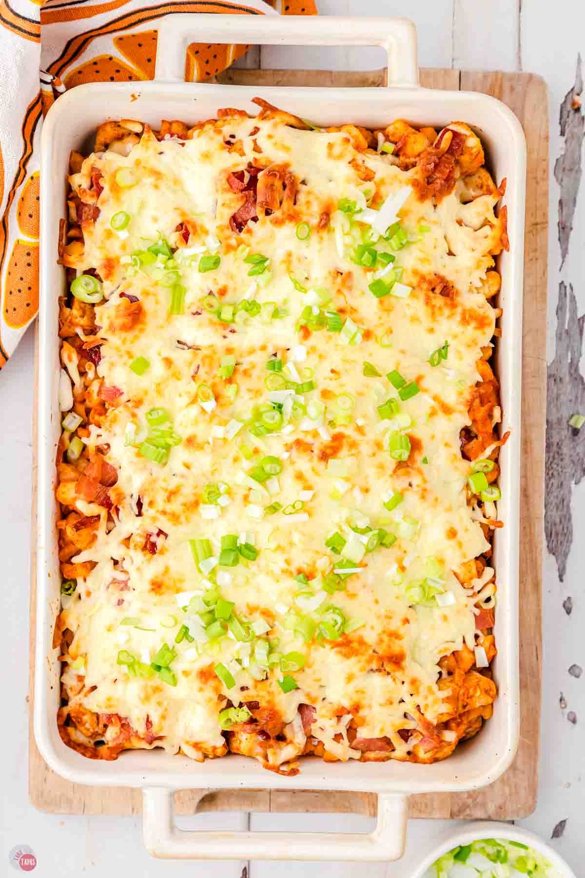 baked buffalo chicken potato casserole in a white dish
