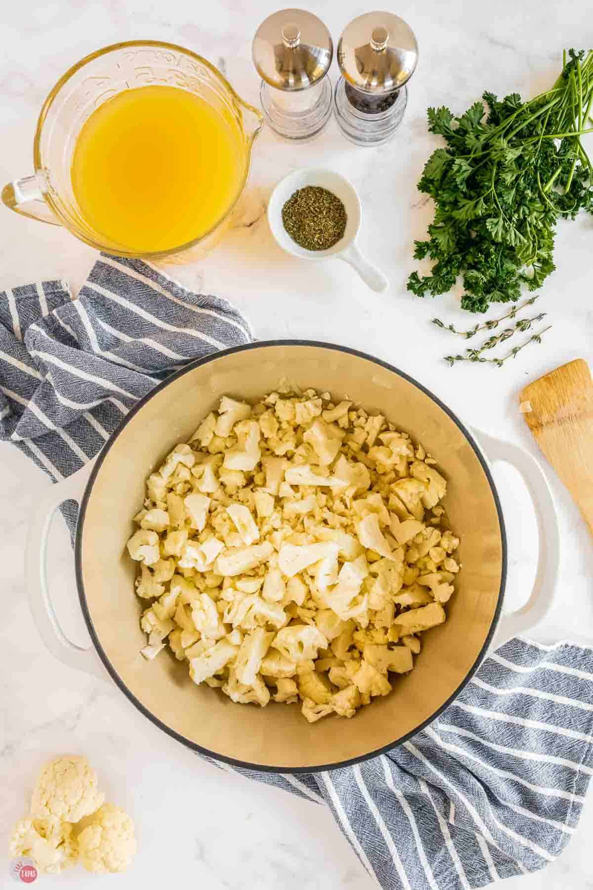 cauliflower florets in a large white pot