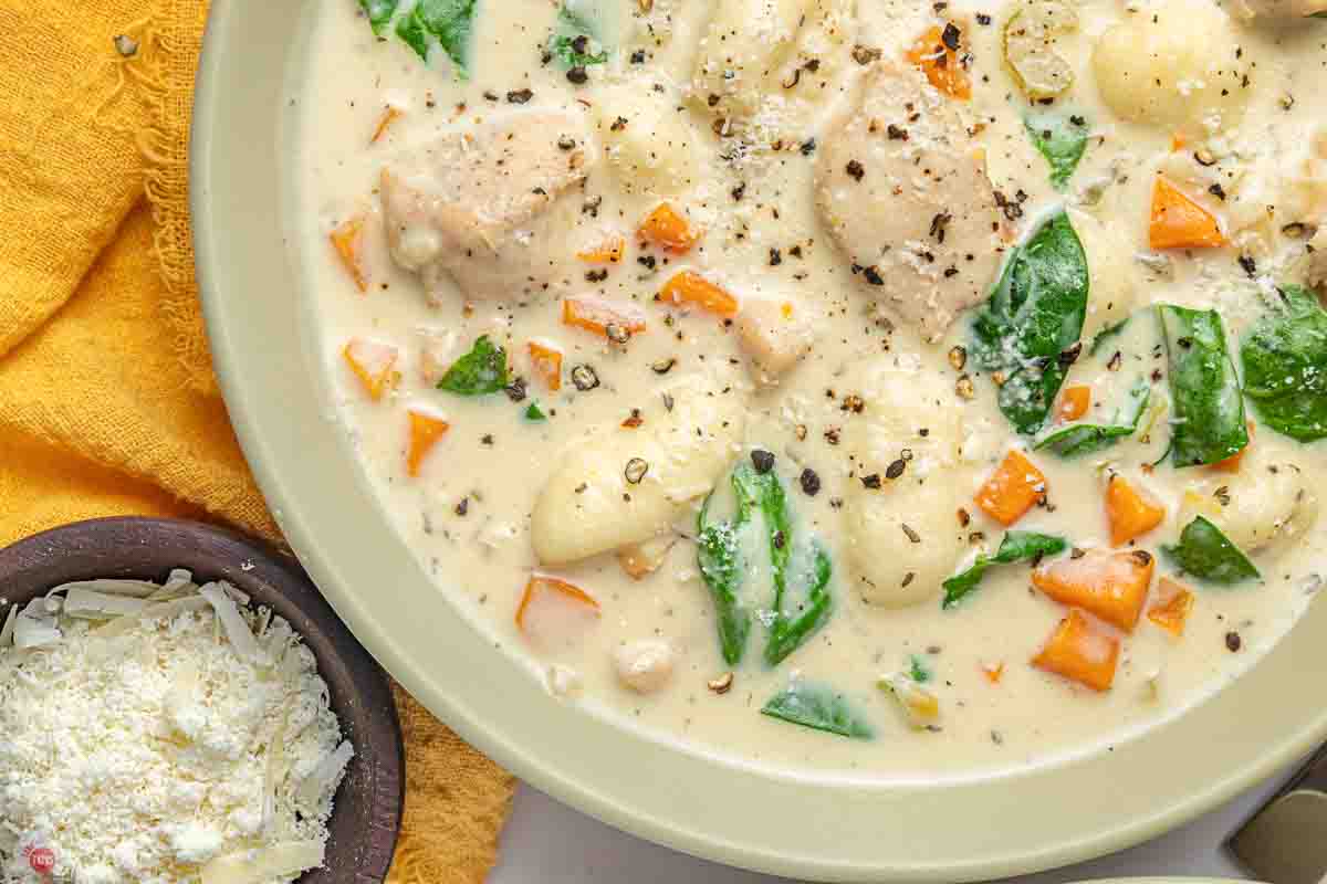 close up of creamy chicken and gnocchi soup in a bowl