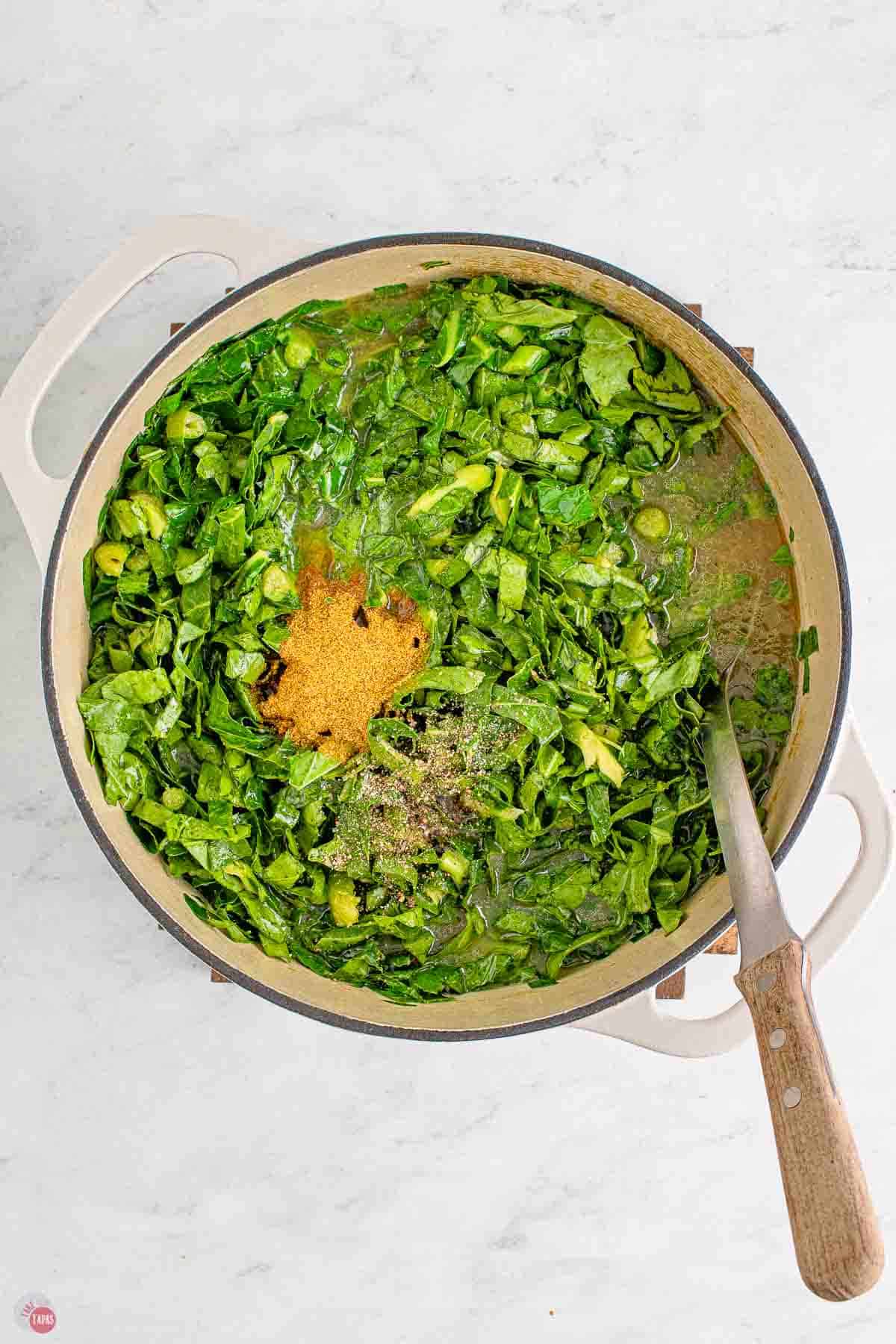 collard greens simmering in a pot