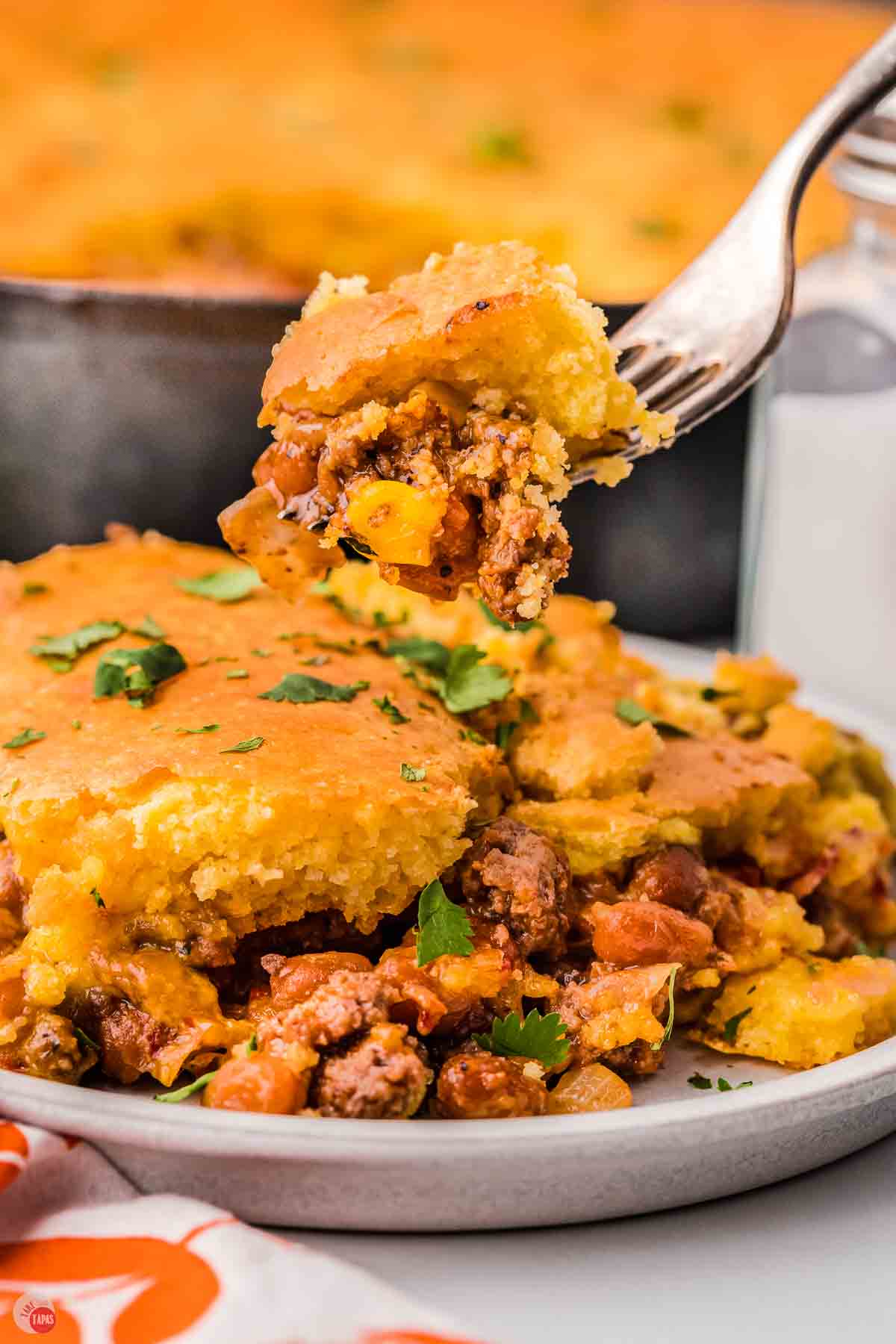 fork with bite of cowboy cornbread casserole on it