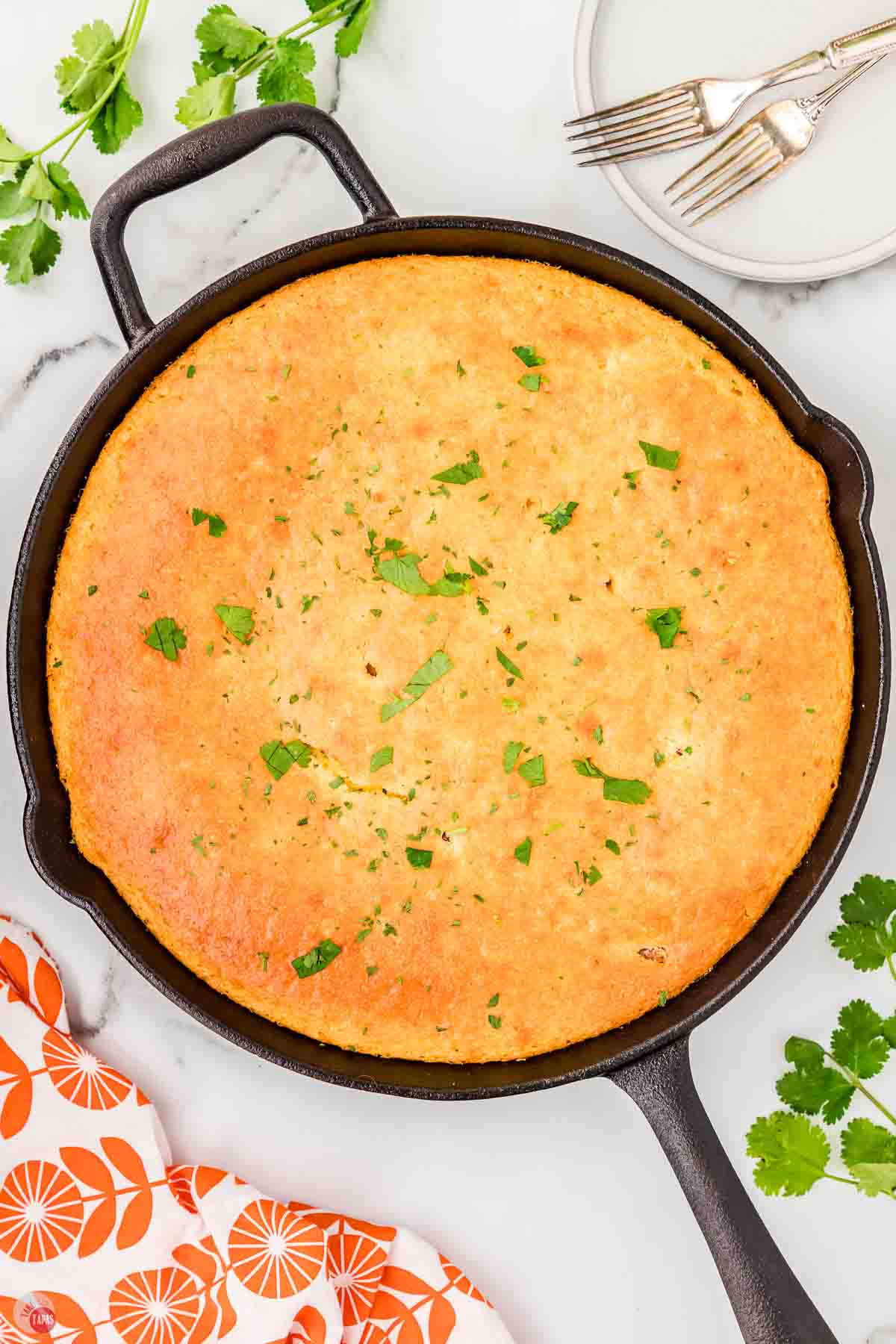 baked cowboy cornbread casserole in a cast iron skillet