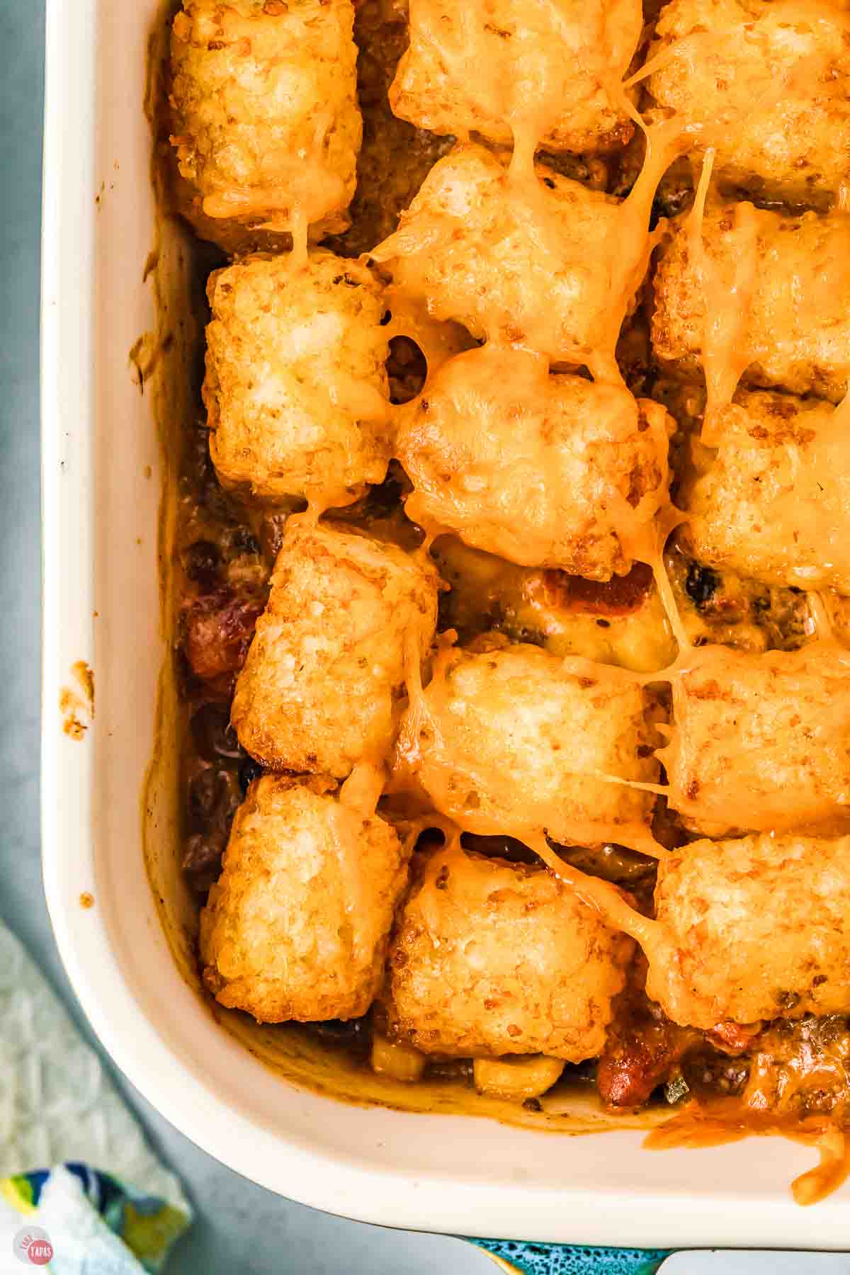 close up of baked casserole topped with tater tots
