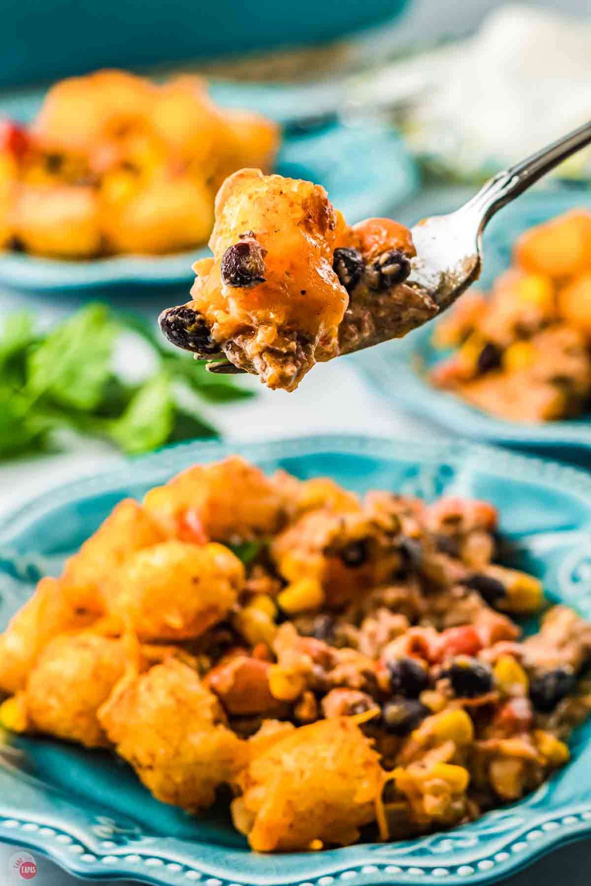 fork with bite of cowboy casserole