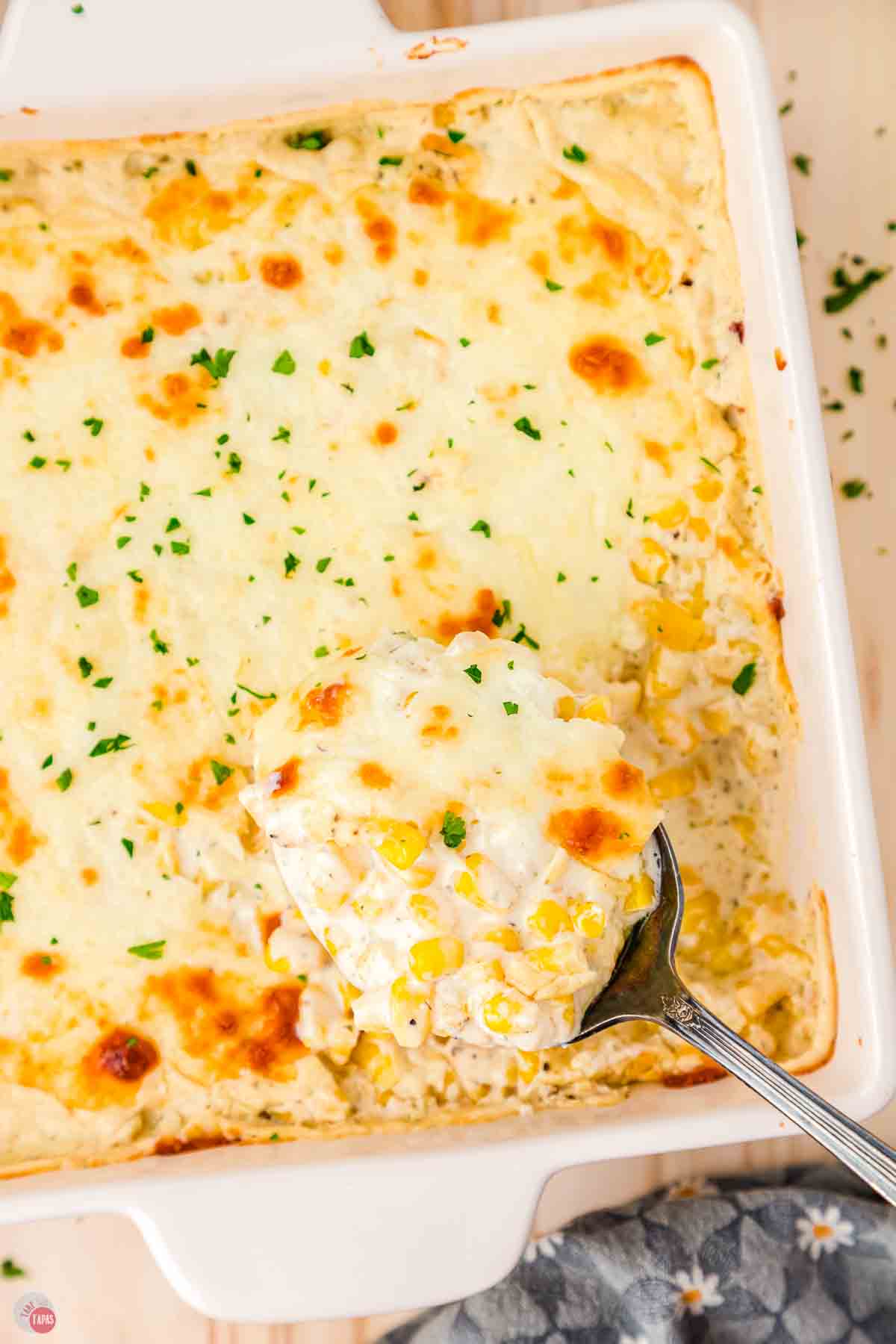 white dish filled with corn casserole