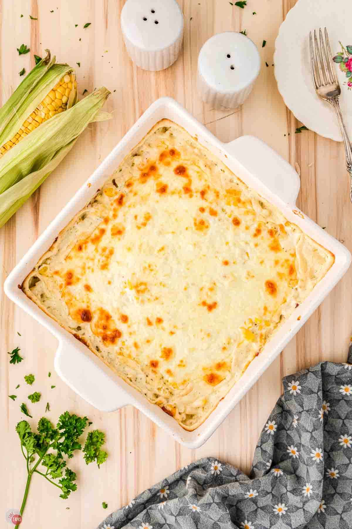 baked cream cheese corn casserole in a white dish
