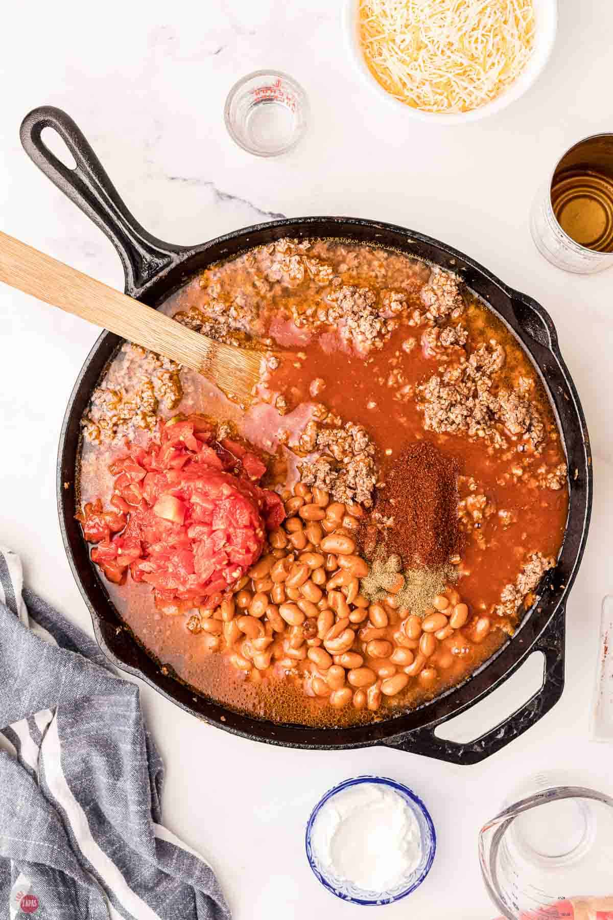 ground beef and beans cooking in a skillet