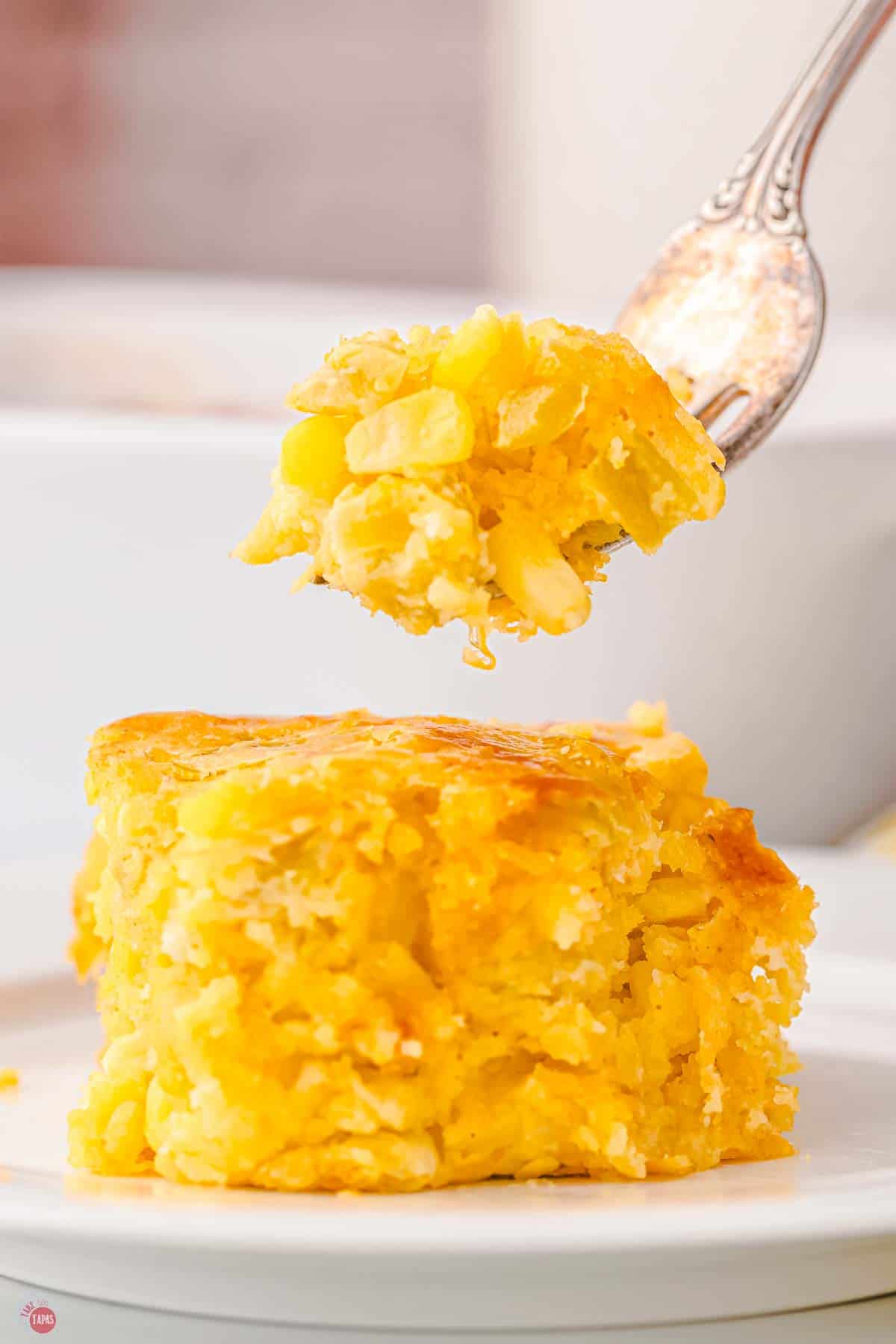 fork with bite of green chile corn casserole