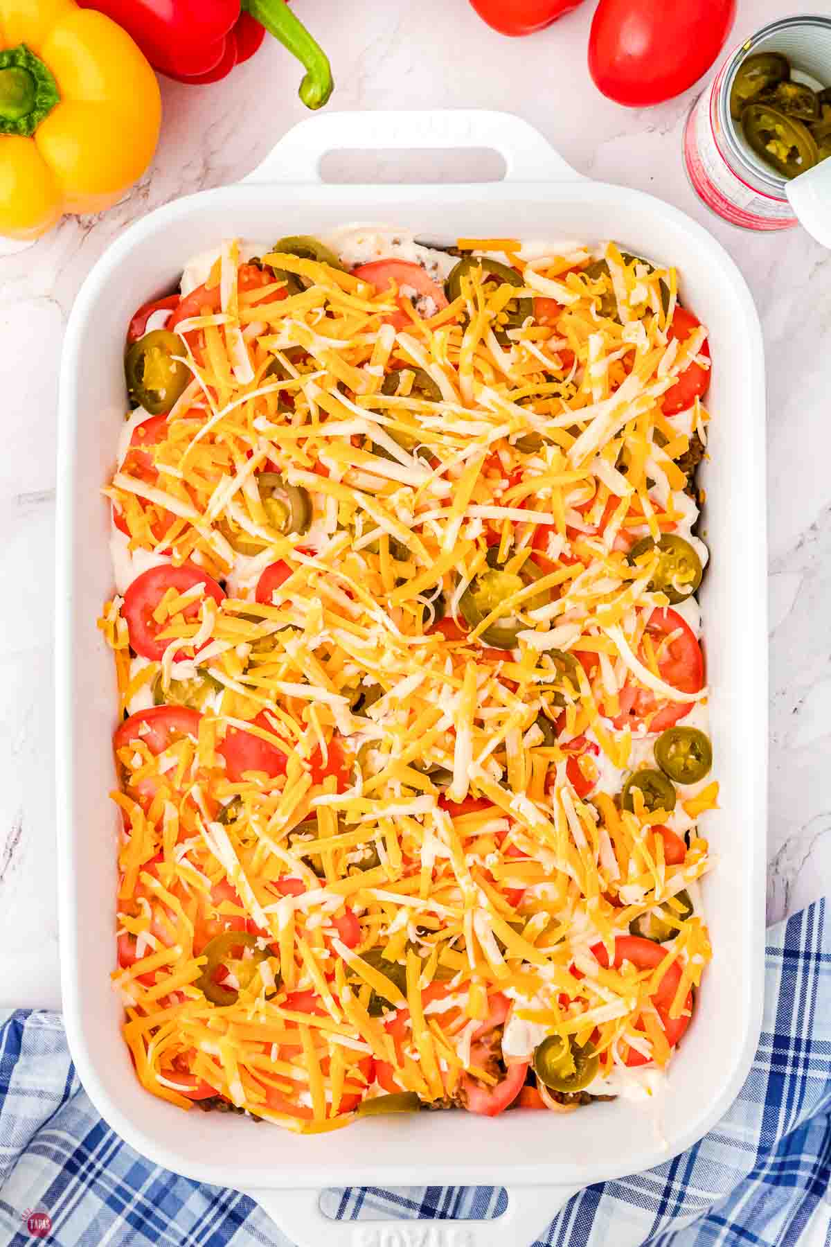 unbaked John Wayne casserole in a white dish