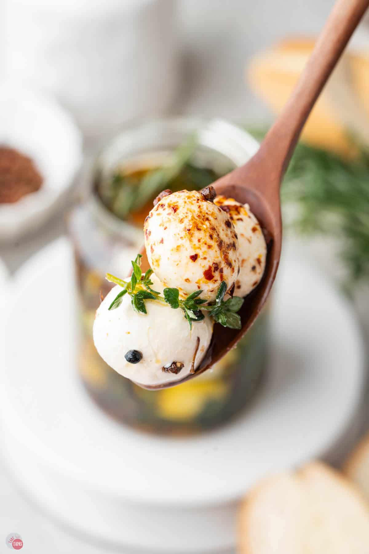 spoon with two mozzarella balls on it