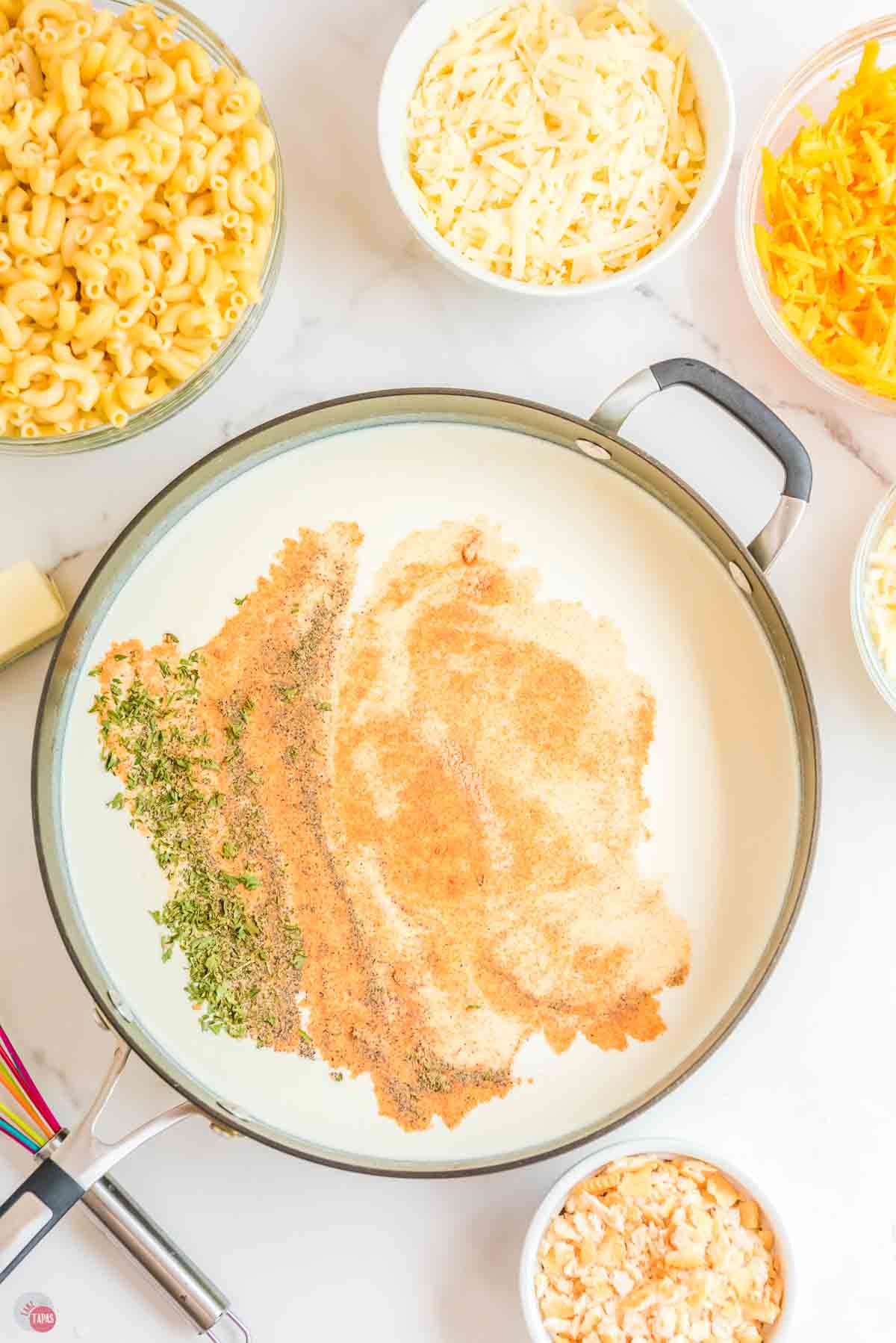 skillet with milk and spices in it