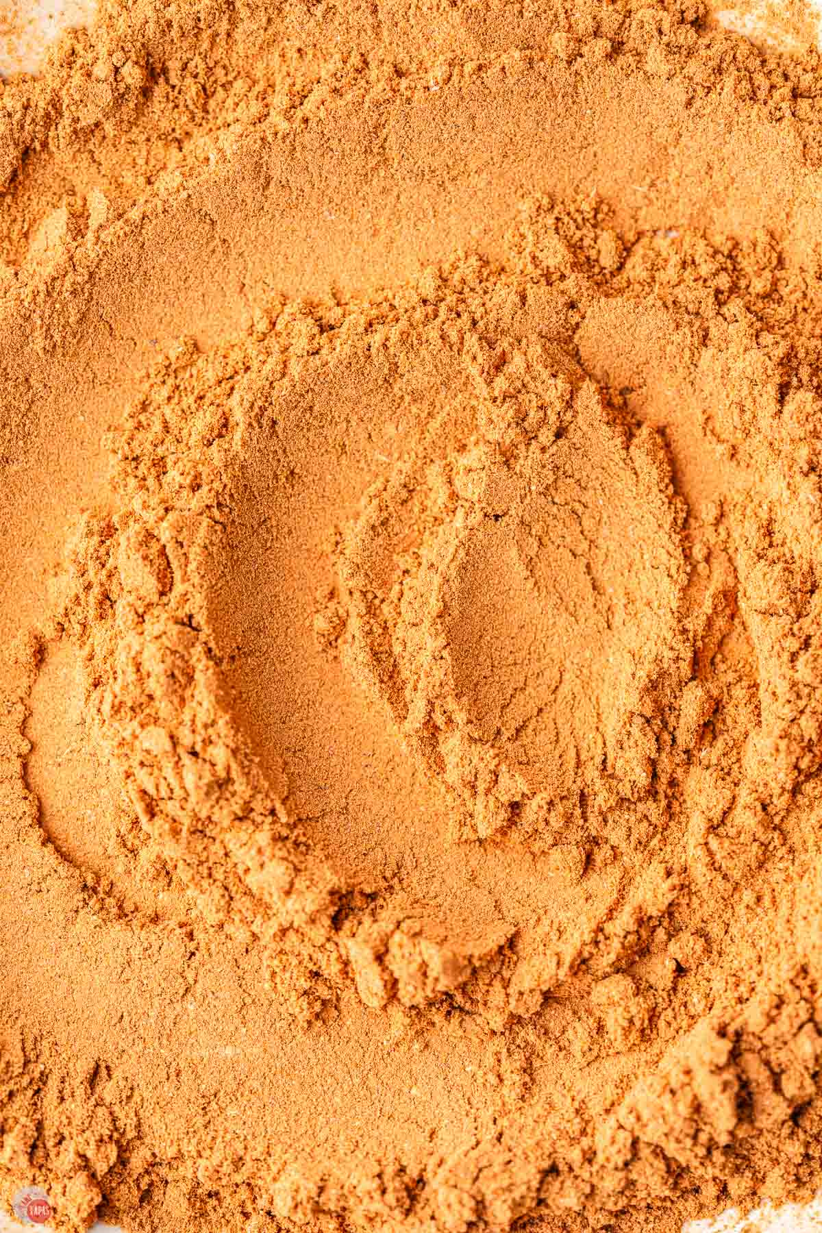 close up of pumpkin pie spice mix swirled on a plate