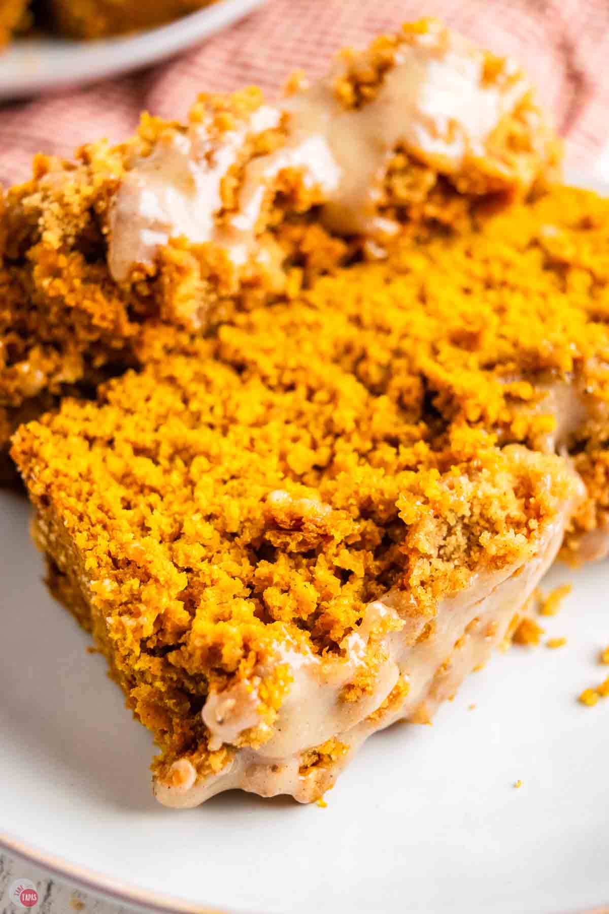 close up of slice of bread with frosting