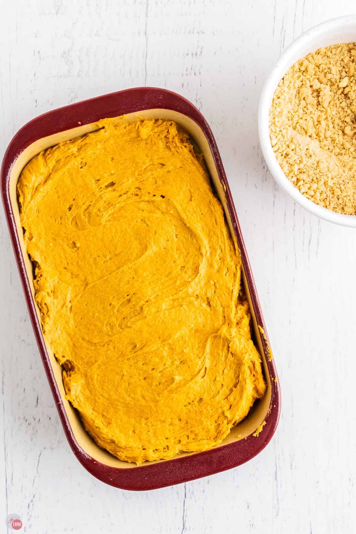 pumpkin bread batter in a loaf pan