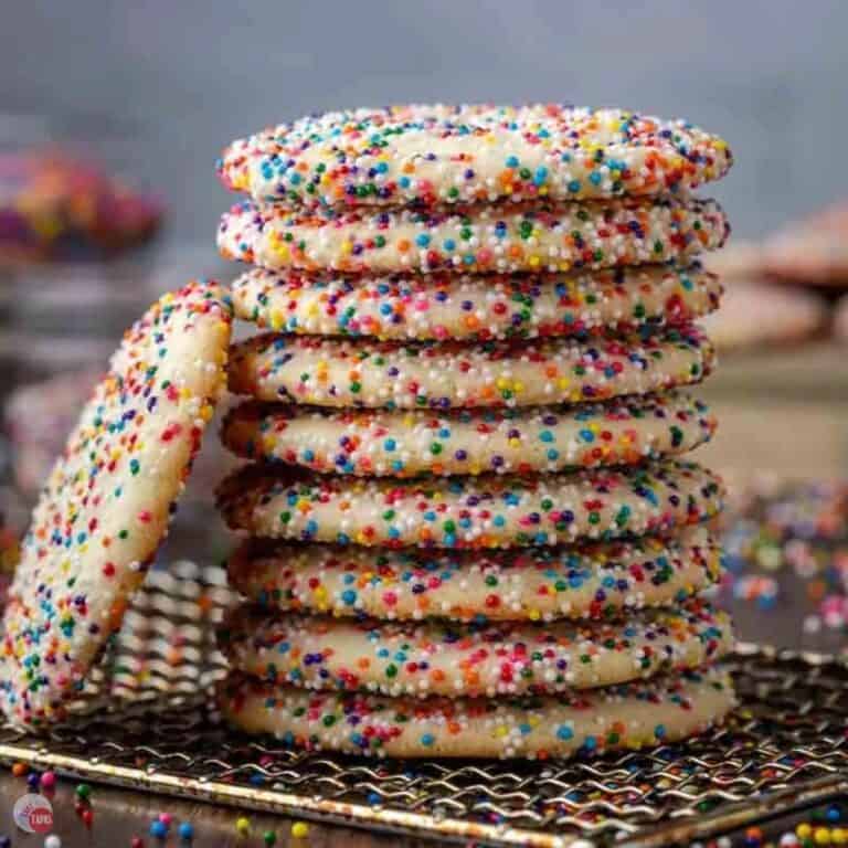 stack of sprinkle cookies coated in rainbow nonpareils