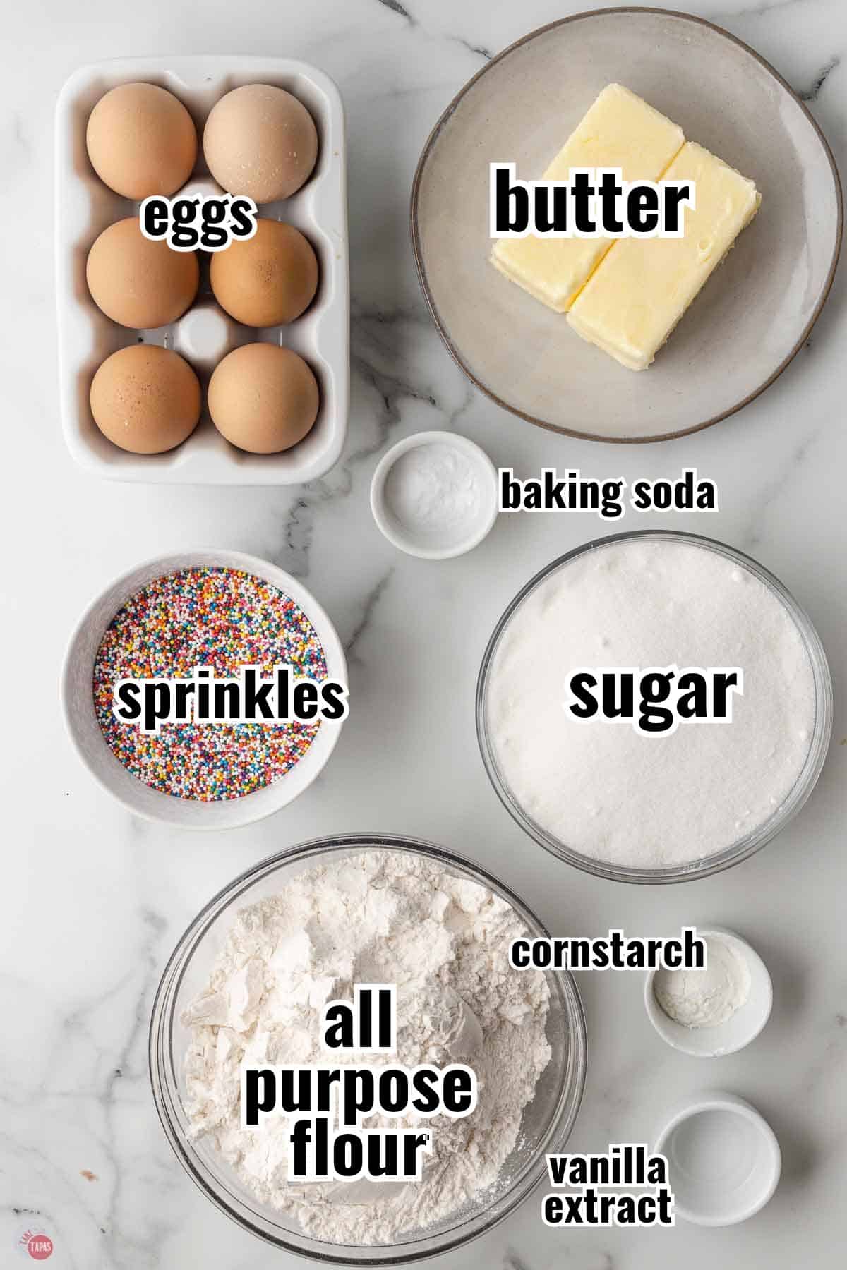 sprinkle cookie ingredients measured into separate bowls