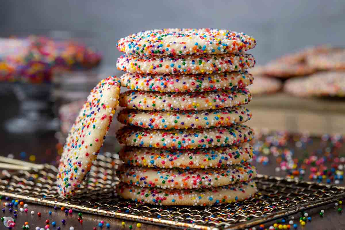 stack of sprinkle cookies coated in rainbow nonpareils