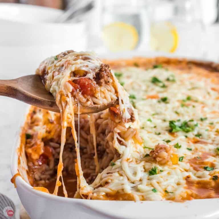 scoop of stuffed pepper casserole being removed from the baking dish