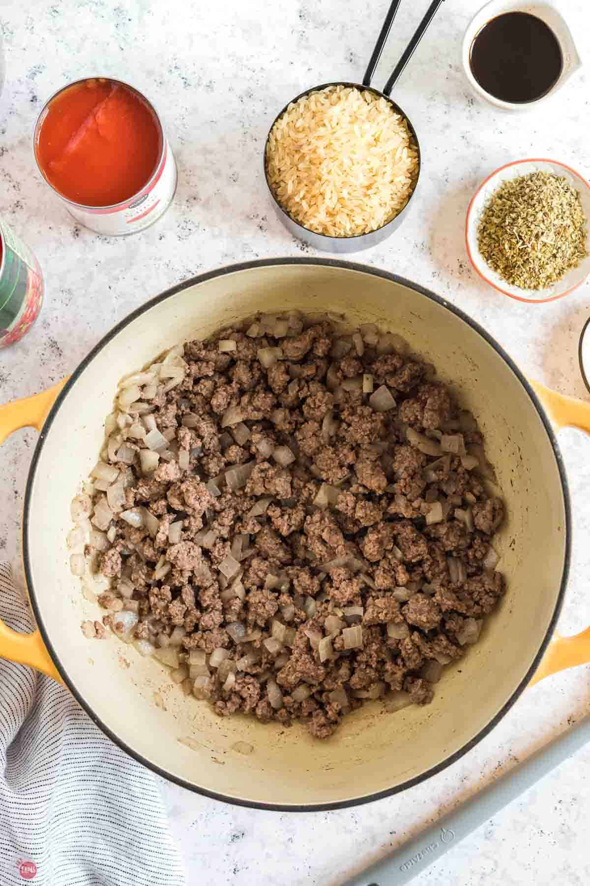 ground beef and onions coking in a pot
