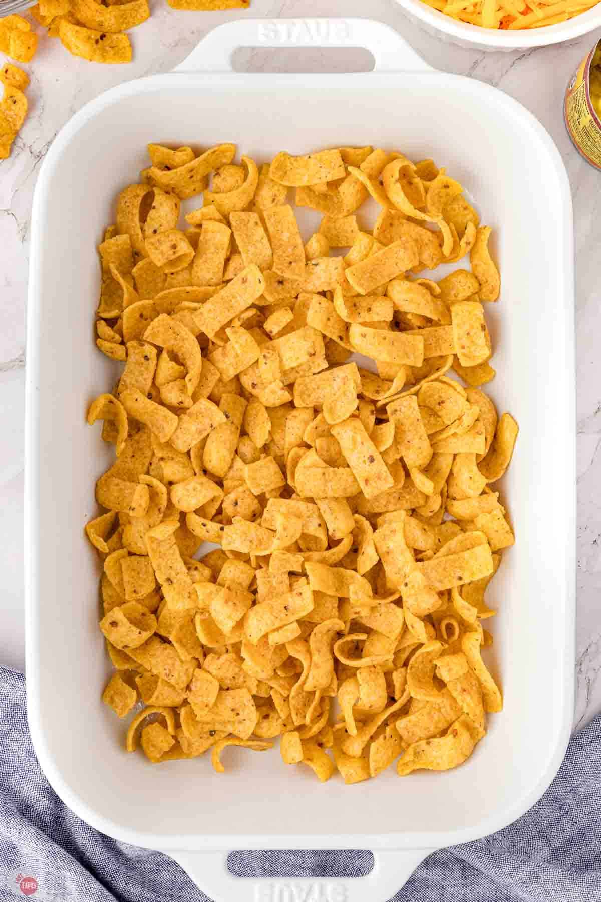 frito corn chips in a white baking dish